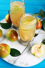 Fresh pear juice with fruit on table close up