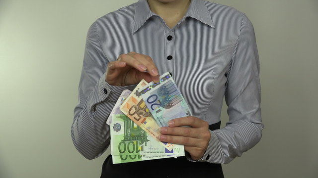 Businesswoman hands hold euro money fan with different banknotes and count them. Closeup shot. 4K UHD video clip.
