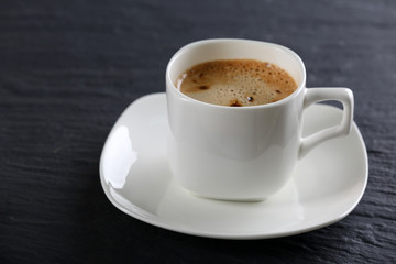 Cup of coffee on table close up