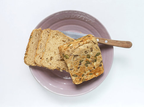 Slice of Cereal bread on white background