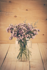 statice flower bouquet  on wood background