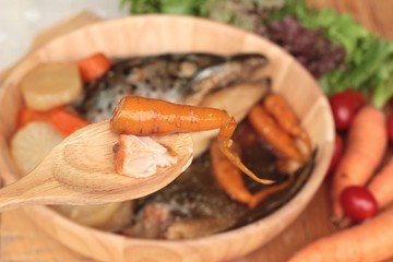 Salmon head cooked of tari yaki sauce with fresh vegetables.
