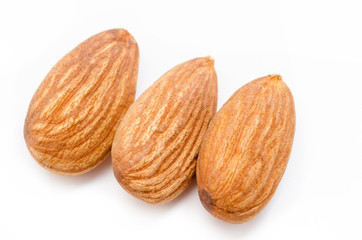 Obraz na płótnie Canvas Whole almonds on a white background