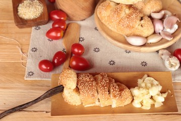 Garlic bread of herb delicious on wood background.