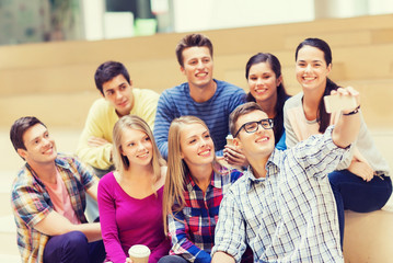 group of students with smartphone and coffee cup