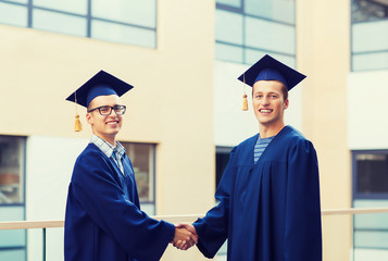 smiling students in mortarboards