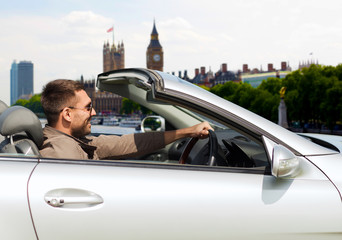 happy man near cabriolet car over london city