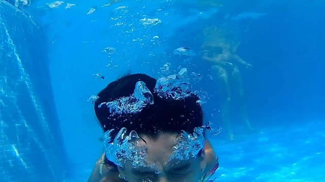 girl snorkelling at a pool