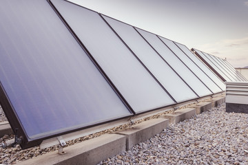 Solar panels / In the picture we can see a solar panels located on the roof of a building