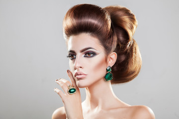 Beautiful girl with brown hair . Volume straight hair Shine with