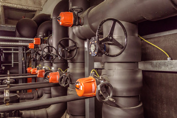 Pump room / In the picture we can see a water pump room with a bunch of valves and cranks