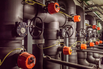 Pump room / In the picture we can see a water pump room with a bunch of valves and cranks