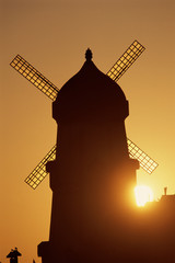 Classic windmill against sunset