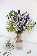 Fragrant bouquet of baby's breath with eucalyptus and lavender in a glass bowl