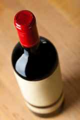 Close up of a bottle of red wine from above