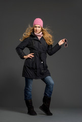 Fototapeta na wymiar Young beautiful woman in winter clothes