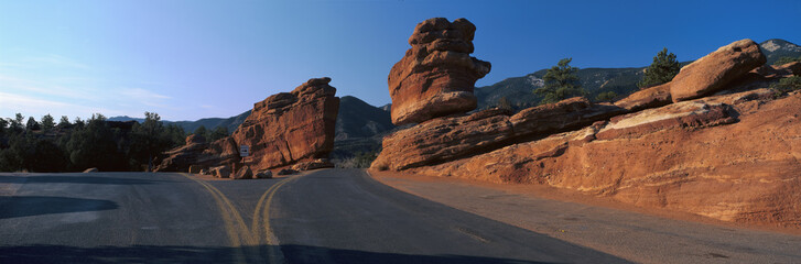 Balanced rock and road in desert