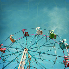 aged and worn vintage photo of ferris wheel