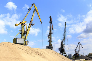 Fototapeta na wymiar landscape with construction cranes. Industrial landscape with standing in a number of construction cranes