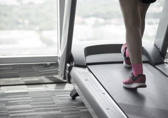 Woman workout on treadmil split-tone