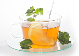 Cup of tea with lemon and mint isolated 