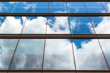 Fototapeta na wymiar Modern Urban Building with Glass Window Reflection