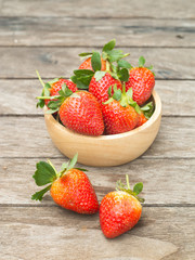 Fresh red strawberry in a wooden bow