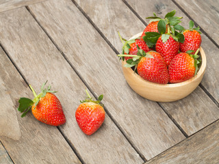 Fresh red strawberry in a wooden bow