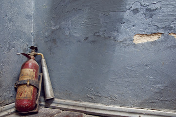  fire extinguisher near  the wall