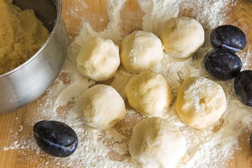 Plum dumplings on the plank table