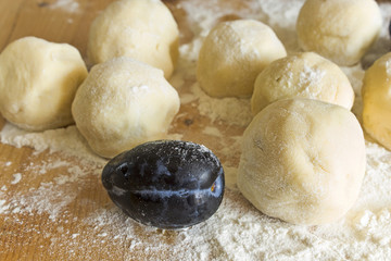 Plum dumplings on the plank table
