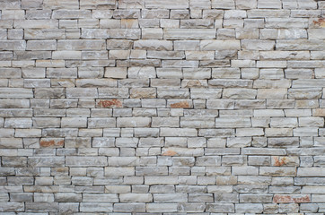 Stone wall made of small limestone bricks