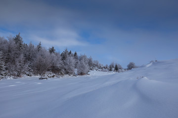 Fototapeta na wymiar Winter scenery in the mountains with fresh powder snow