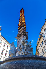 Fototapeta na wymiar Robba Fountain and St. Nicholas Cathedral in Ljubljana