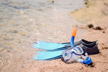 Skin diving equipment standing ready on a beach