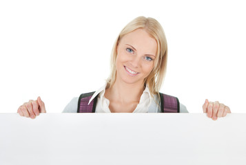 Naklejka premium Beautiful student girl presenting empty board