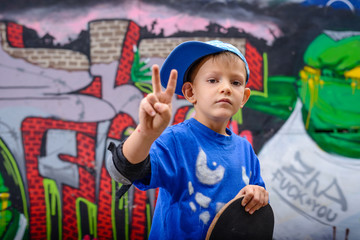 Young boy making a V-sign