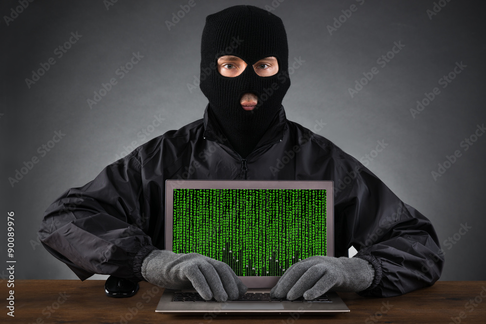 Poster Hacker Typing On Laptop With Binary Code