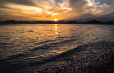 sea sunset with cloudy sky