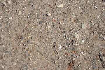 Irregular coarse gravel, sand and pebbles on a construction site texture material
