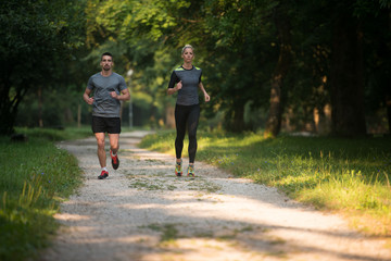 Healthy Fitness Couple Jogging Outdoors