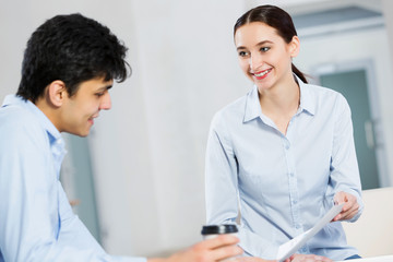 Two young people working as partners