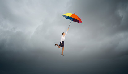 Woman fly on umbrella