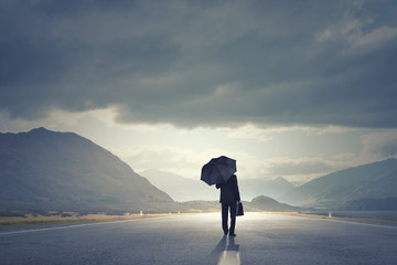 Man with black umbrella © Sergey Nivens