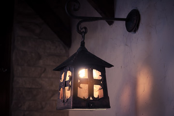 Fototapeta na wymiar Old fashioned lantern in dark room