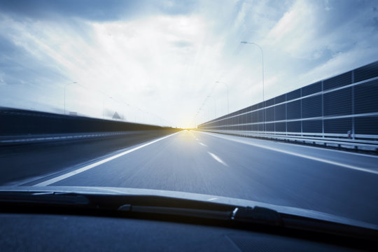 Car view with motion blur road background