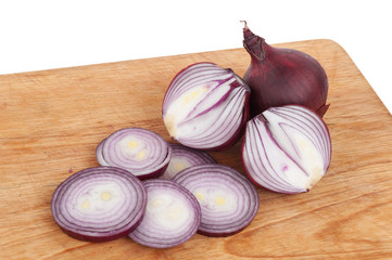 Sliced red onions on a wooden board