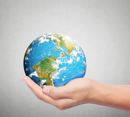  global in hands.Ecology concept. Elements of this image are fur