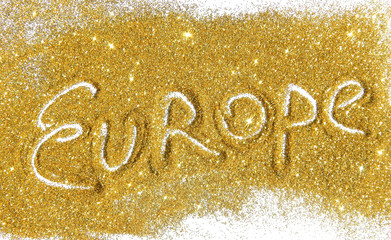 Inscription Europe on golden glitter sparkles on white background
