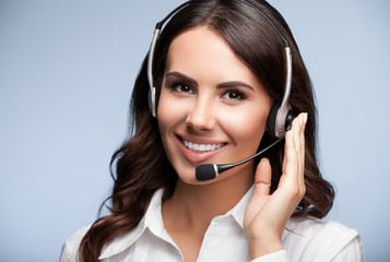 Portrait of happy smiling customer support female phone operator